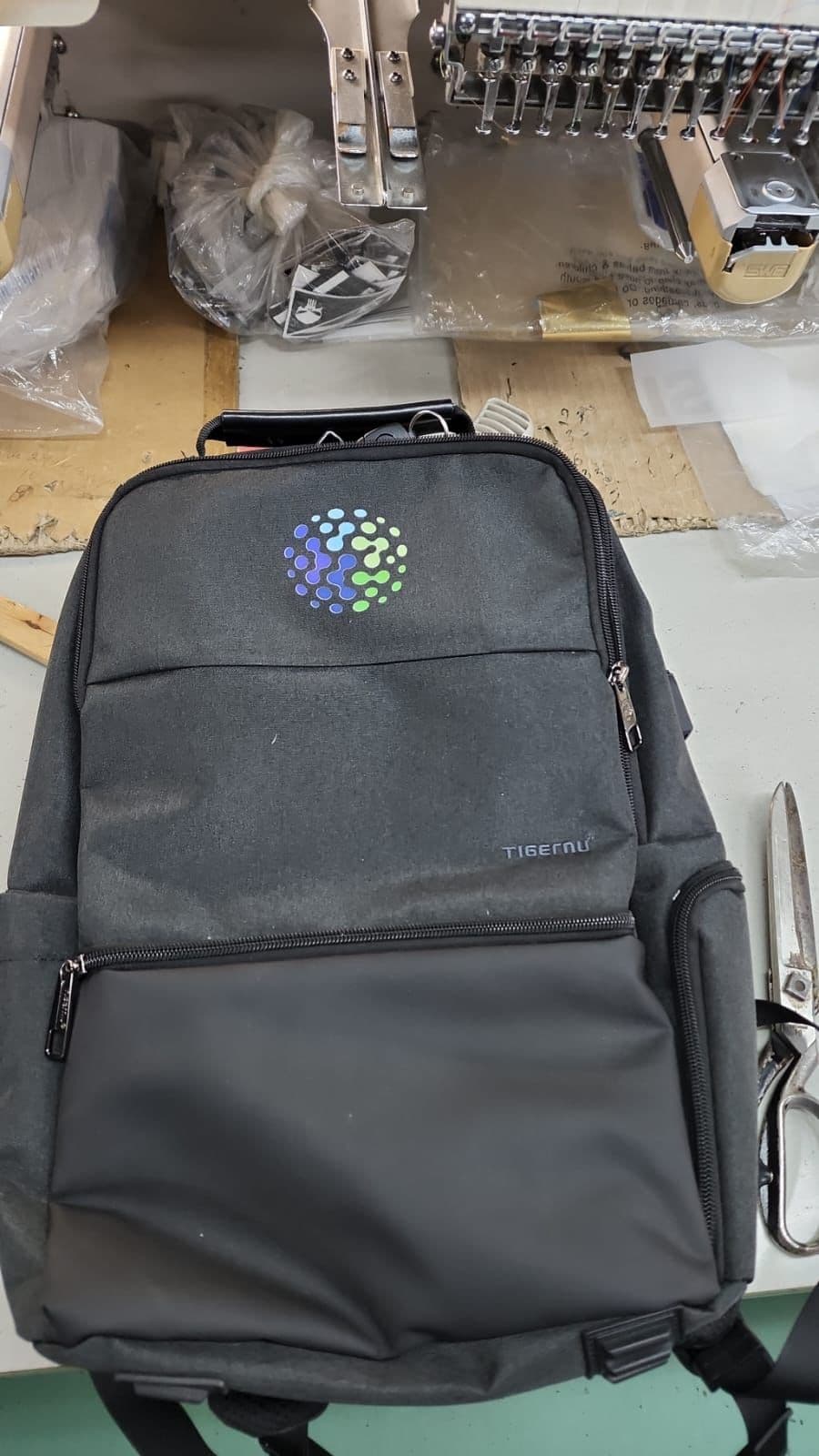 Black backpack with a colorful company logo, from a past business order