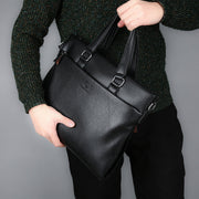 man holding leather shoulder bag
